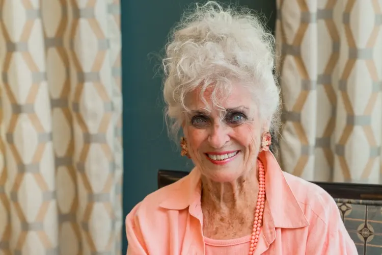Smiling Horizon resident in her cottage